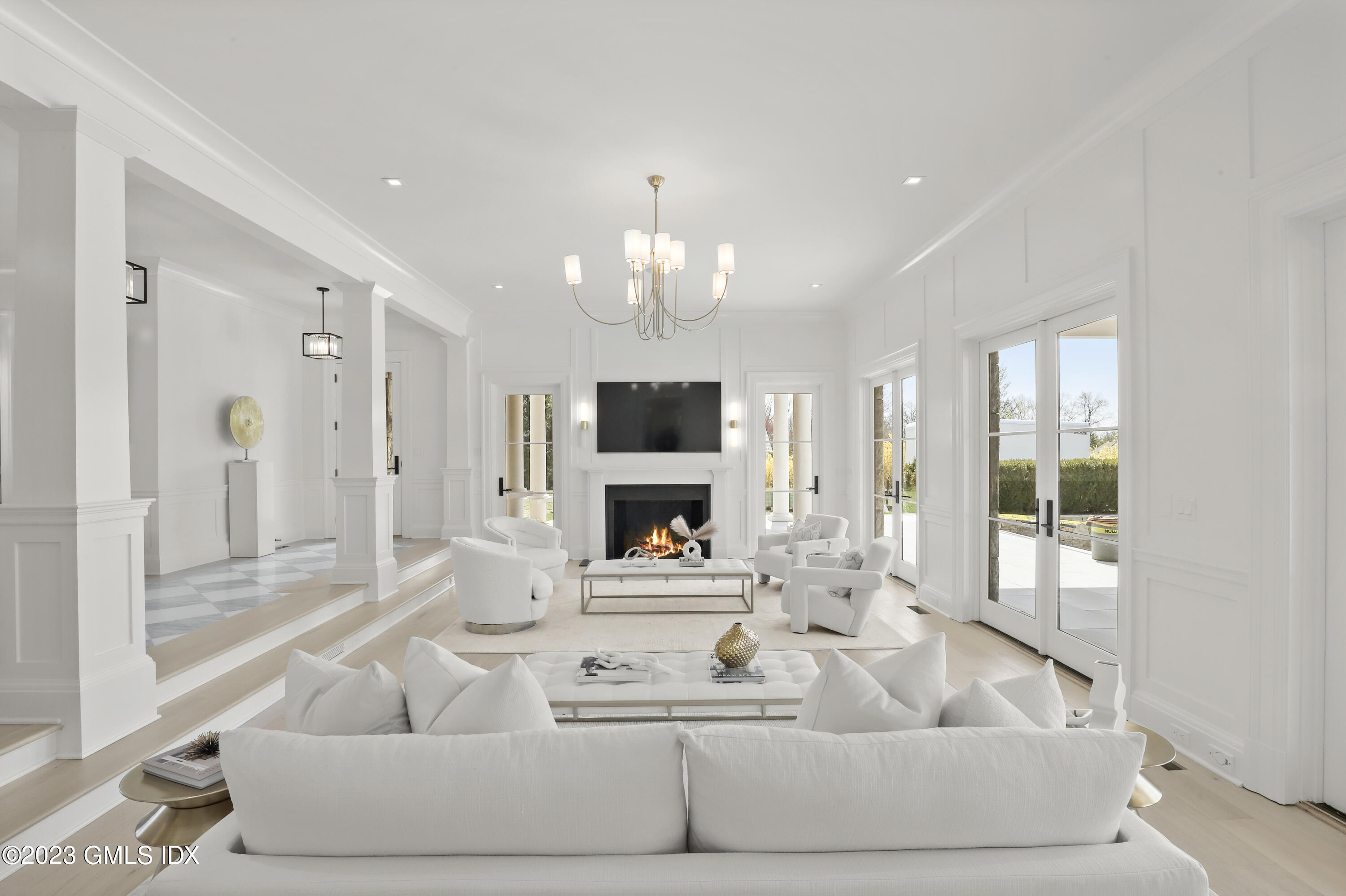 32 Meadowcroft Lane Greenwich, CT 06830 - Photo 4 of 43 a living room with furniture and a chandelier