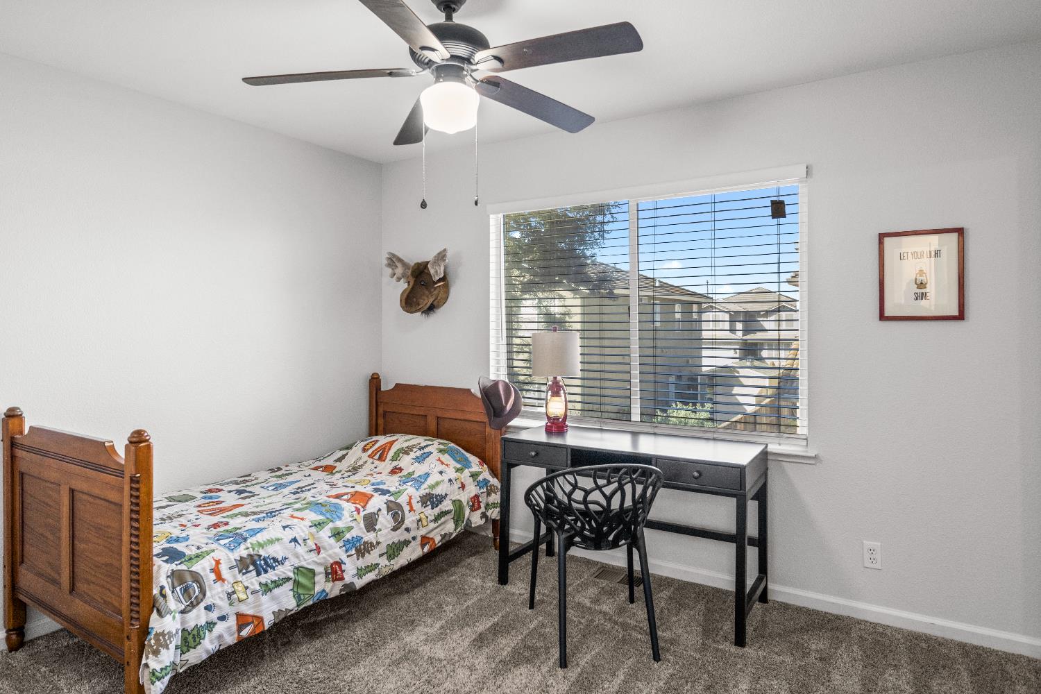 637 Rebekah Court Ripon, CA 95366 - Photo 40 of 69 a bedroom with a bed and a chandelier