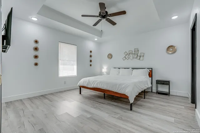 a bedroom with a bed and a window