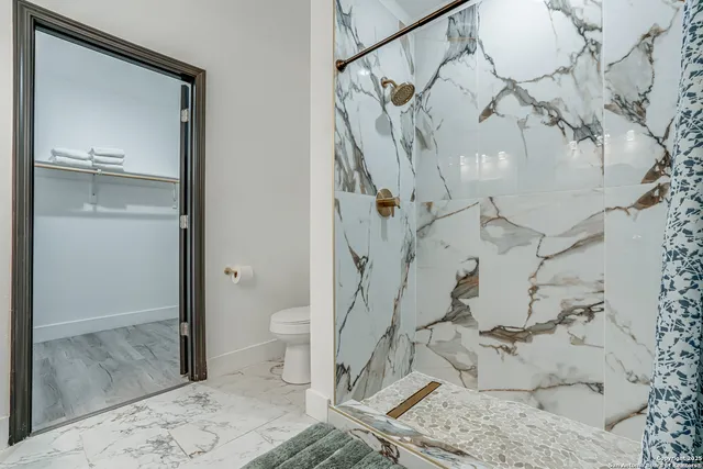 a bedroom with double bed and a window