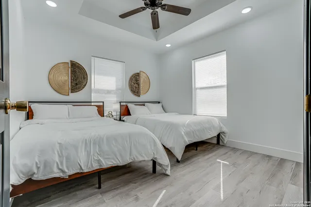 a view of balcony with wooden floor and seating space
