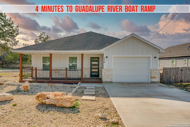 a view of a hallway with wooden floor and windows