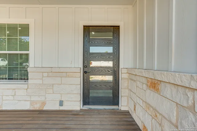 a bedroom with furniture and window