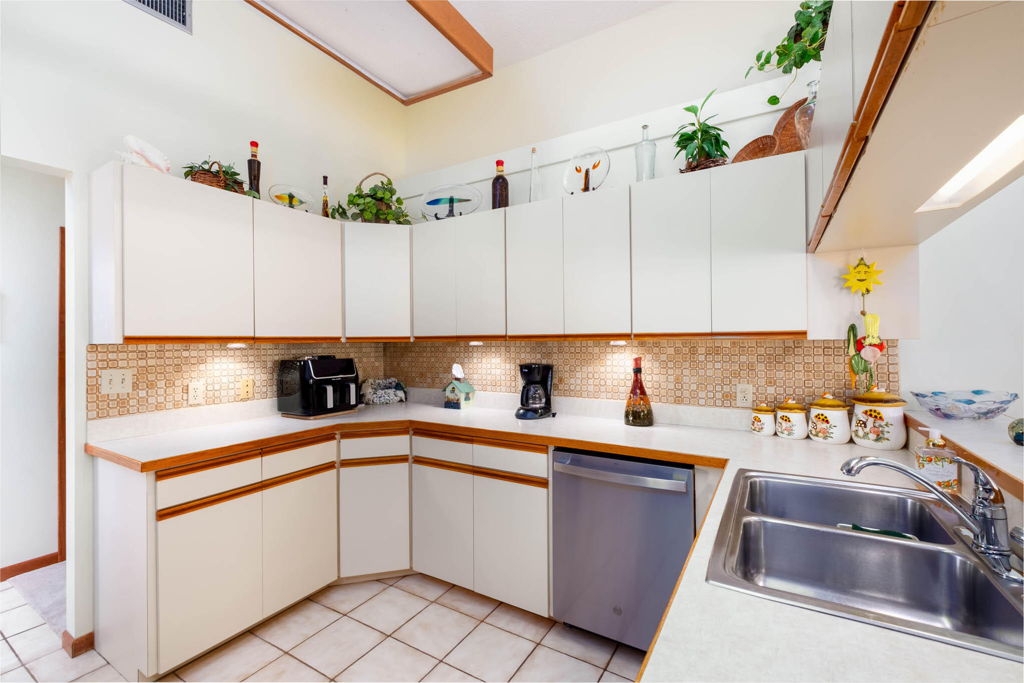 216 Sonny Road Tavernier, FL 33070 - Photo 11 of 49 a kitchen with a sink stove and cabinets