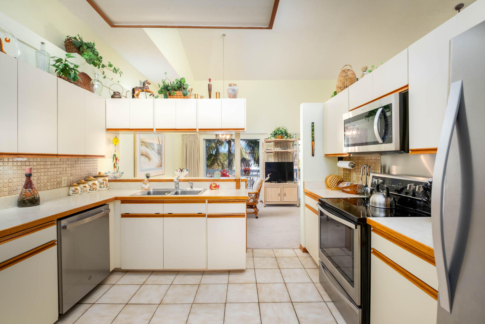 216 Sonny Road Tavernier, FL 33070 - Photo 12 of 49 a kitchen with a sink stove and cabinets