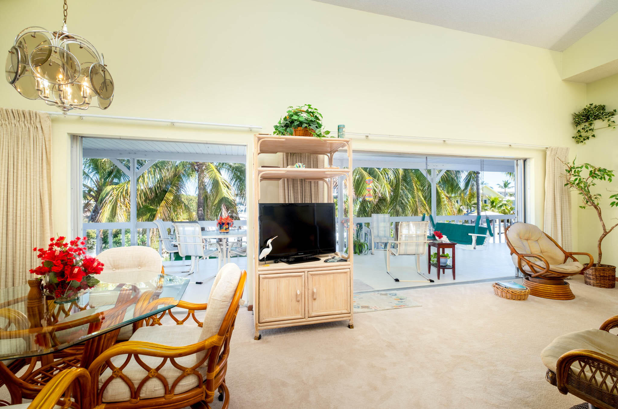 216 Sonny Road Tavernier, FL 33070 - Photo 14 of 49 a living room with patio furniture and a flat screen tv