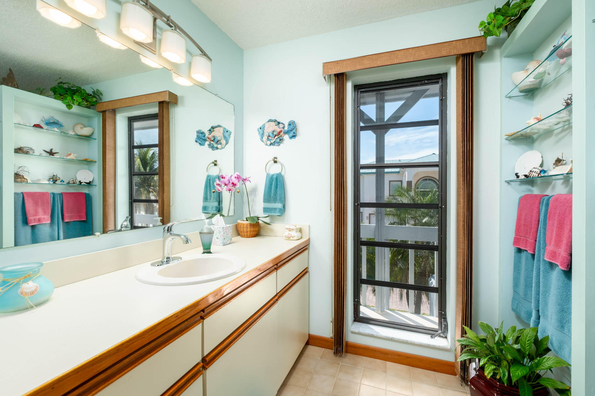 216 Sonny Road Tavernier, FL 33070 - Photo 24 of 49 a en suite bathroom with a sink and a mirror