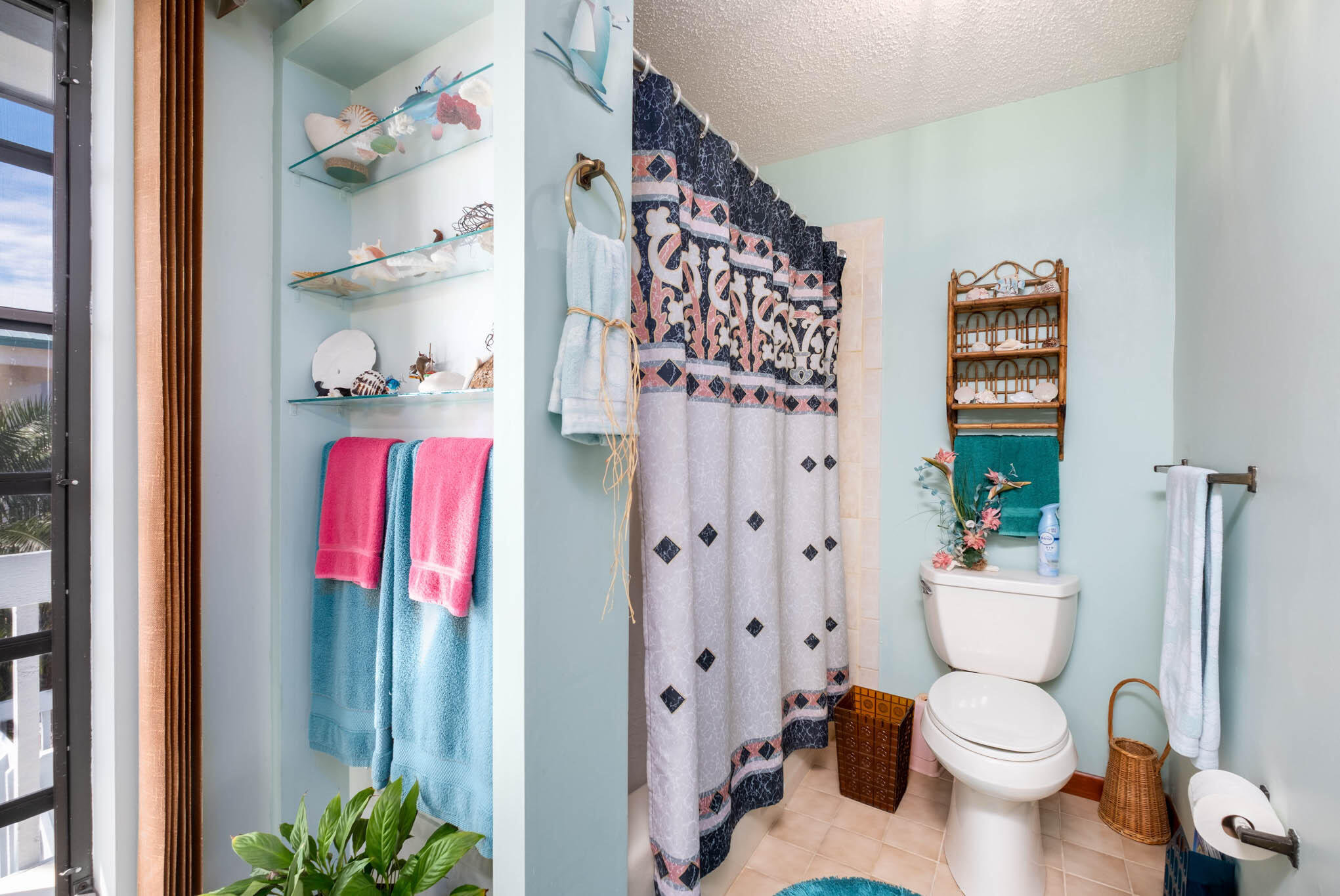 216 Sonny Road Tavernier, FL 33070 - Photo 25 of 49 a bathroom with a toilet and a shower curtain
