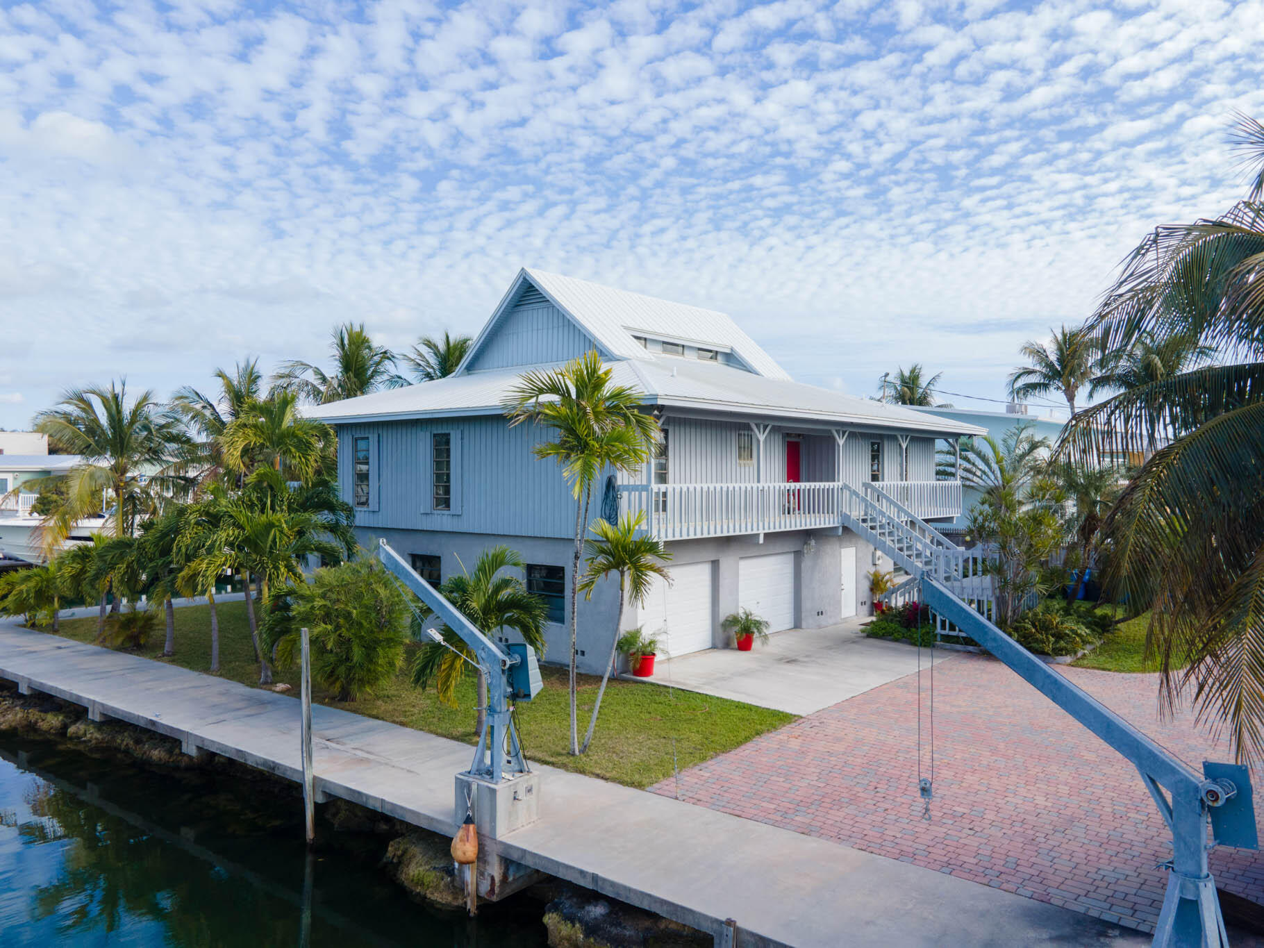 216 Sonny Road Tavernier, FL 33070 - Photo 35 of 49 a front view of a house with garden