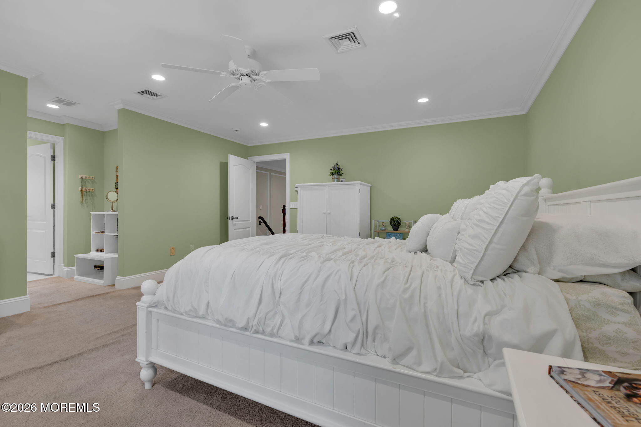 672 Winding River Road Brick, NJ 08724 - Photo 47 of 111 a spacious bedroom with a bed and a chandelier