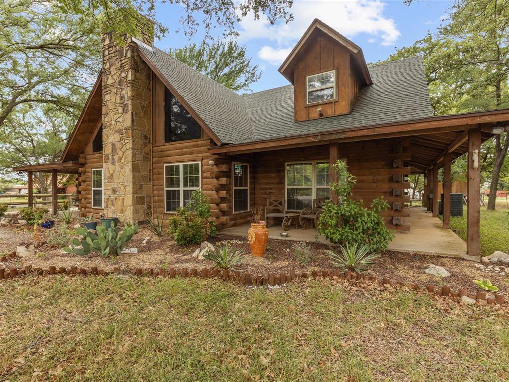 4101 County Road 1022 Joshua, TX 76058 - Photo 1 of 1 a front view of a house with garden