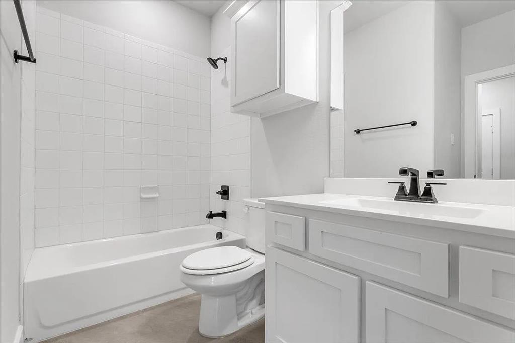 6246 Shasta Creek Road Celina, TX 75009 - Photo 20 of 24 a bathroom with a bathtub shower sink vanity and toilet