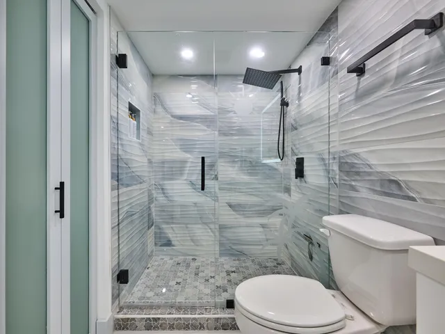 a living room with furniture a flat screen tv and a large window