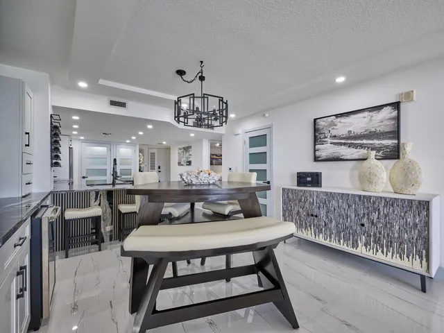 an aerial view of a house with yard swimming pool and outdoor seating