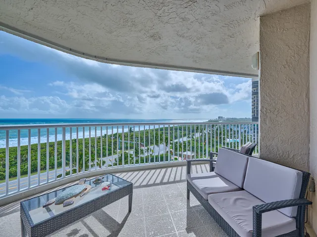 a view of a garden with a building in the background