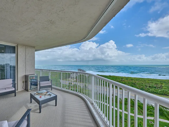 a bathroom with a sink mirror and painting on the wall