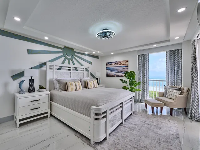 a view of a tall building next to a road