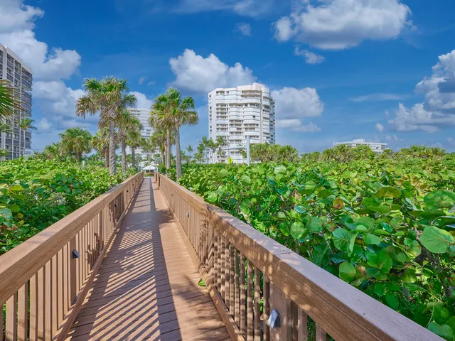 an aerial view of a house with a yard and outdoor seating