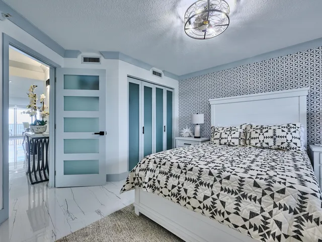 a kitchen with stainless steel appliances kitchen island granite countertop a stove a sink and a refrigerator