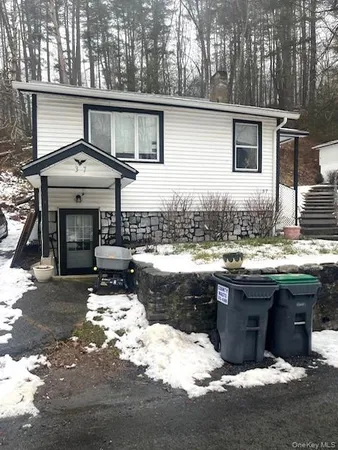 a view of a house with a sink and wooden floor