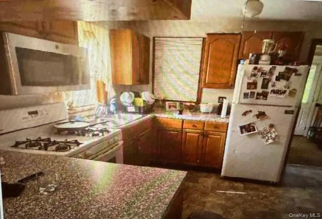 33 Eden Road, Unit 41 Cuddebackville, NY 12729 - Photo 30 of 34 a kitchen with stainless steel appliances kitchen island granite countertop a sink stove and granite counter top
