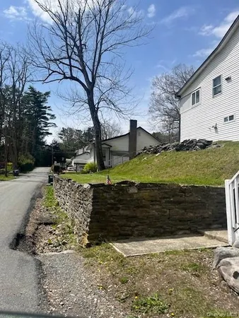 a view of a yard with large tree