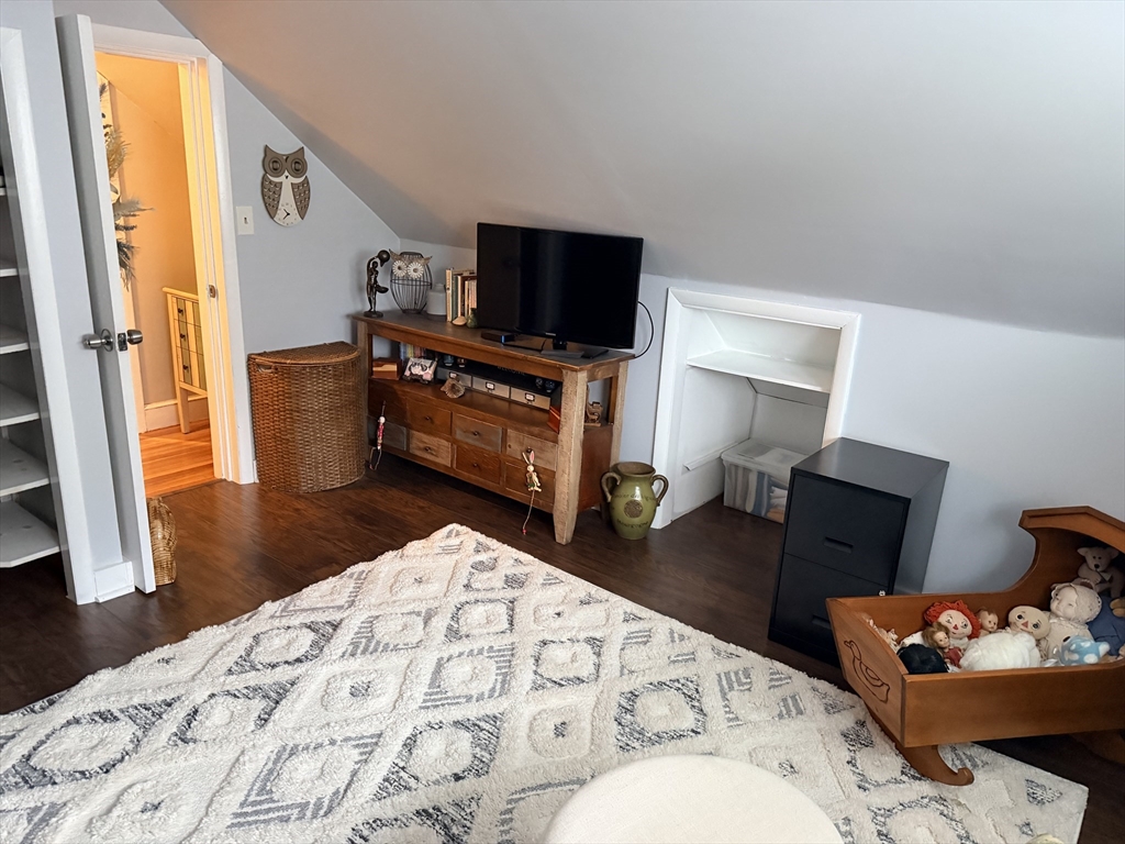 26 Colonial Road Peabody, MA 01960 - Photo 14 of 25 a bedroom with a bed and flat screen tv