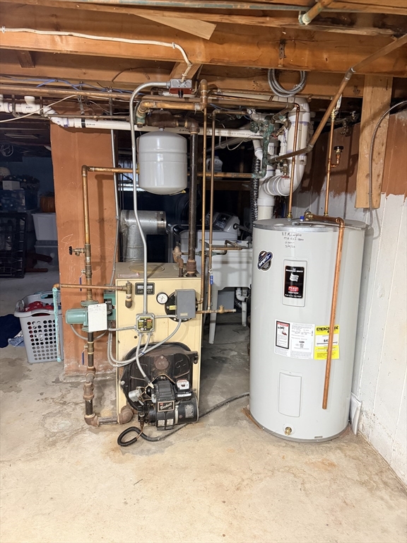 26 Colonial Road Peabody, MA 01960 - Photo 18 of 25 a view of a storage room with furniture