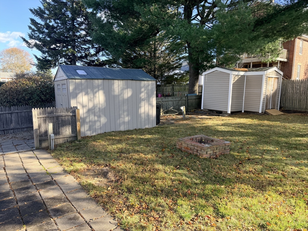 26 Colonial Road Peabody, MA 01960 - Photo 25 of 25 a backyard of a house with table and chairs