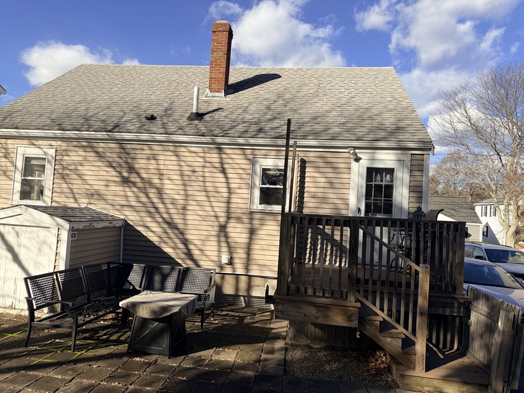 26 Colonial Road Peabody, MA 01960 - Photo 4 of 25 a front view of a house with wooden fence