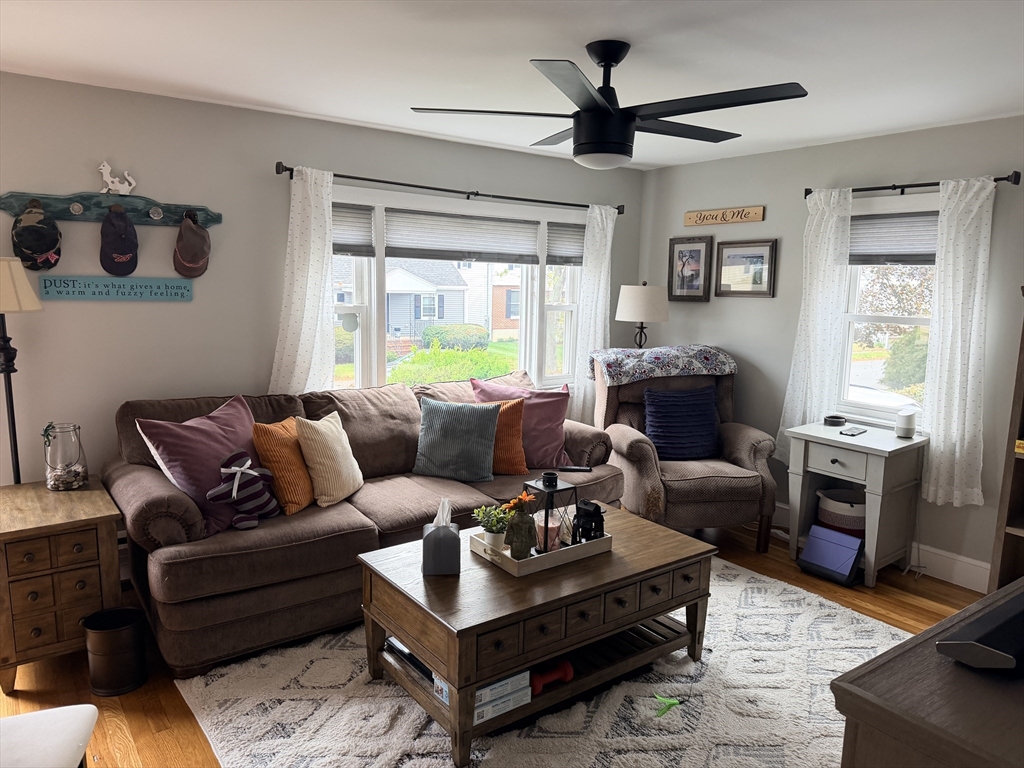 26 Colonial Road Peabody, MA 01960 - Photo 10 of 25 a living room with furniture a ceiling fan and a window