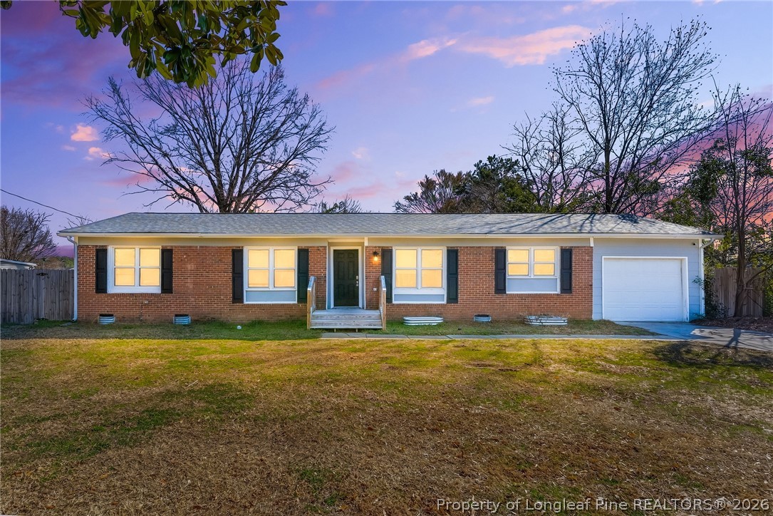 a large house with a large yard and large trees