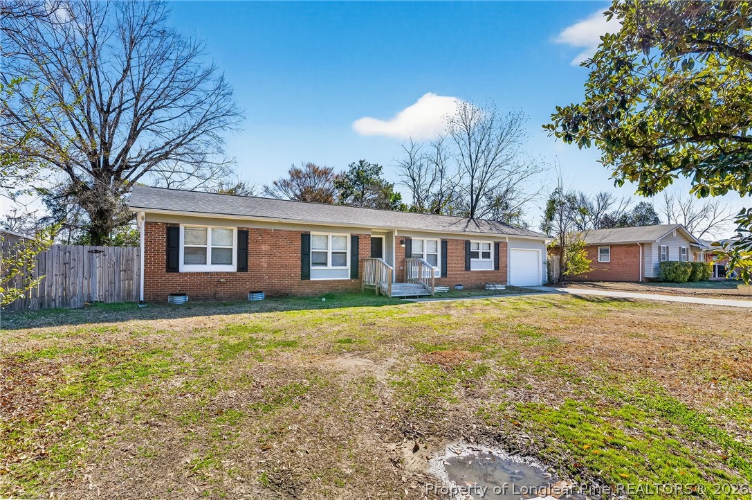 1083 Strickland Bridge Road Fayetteville, NC 28304 - Photo 13 of 25 a view of a house with a yard