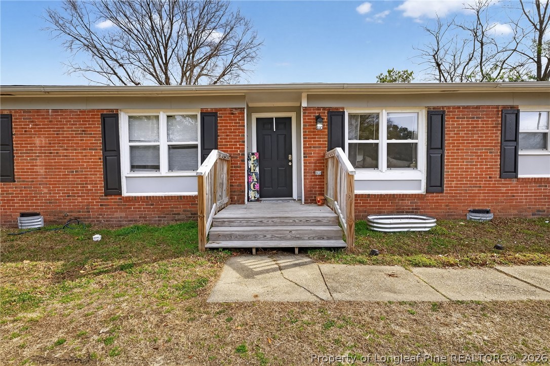 1083 Strickland Bridge Road Fayetteville, NC 28304 - Photo 15 of 25 front view of a house with a yard