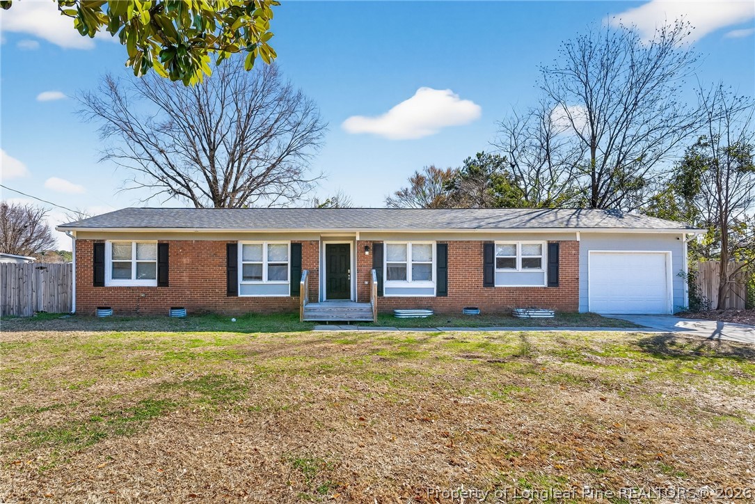 1083 Strickland Bridge Road Fayetteville, NC 28304 - Photo 16 of 25 a view of a house with a yard