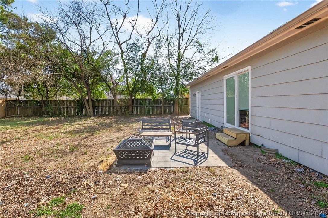 1083 Strickland Bridge Road Fayetteville, NC 28304 - Photo 19 of 25 a view of a backyard with sitting area