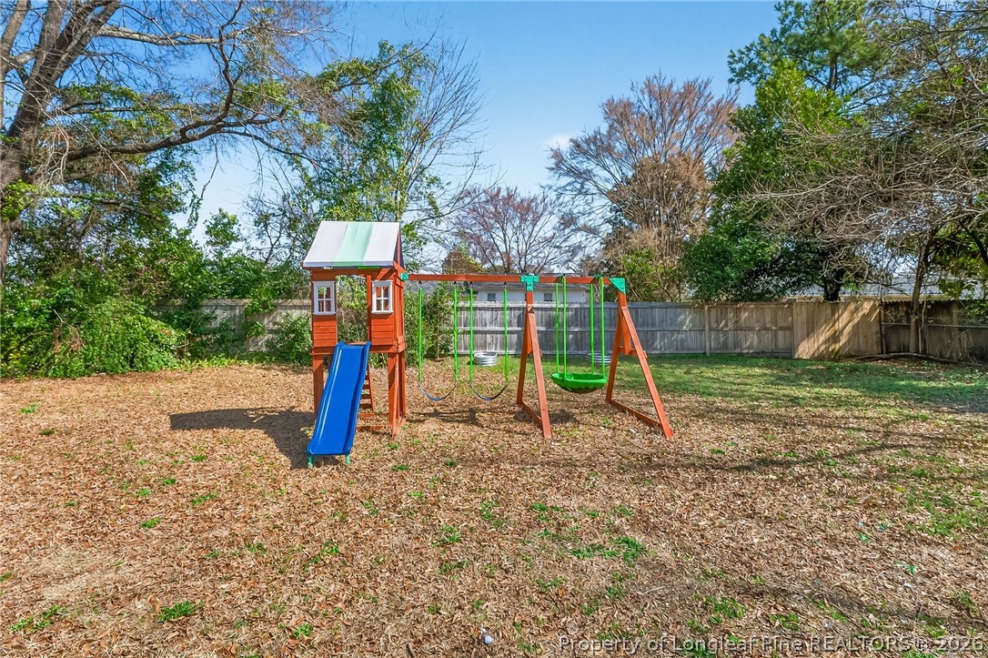 1083 Strickland Bridge Road Fayetteville, NC 28304 - Photo 20 of 25 a view of outdoor space with a slide