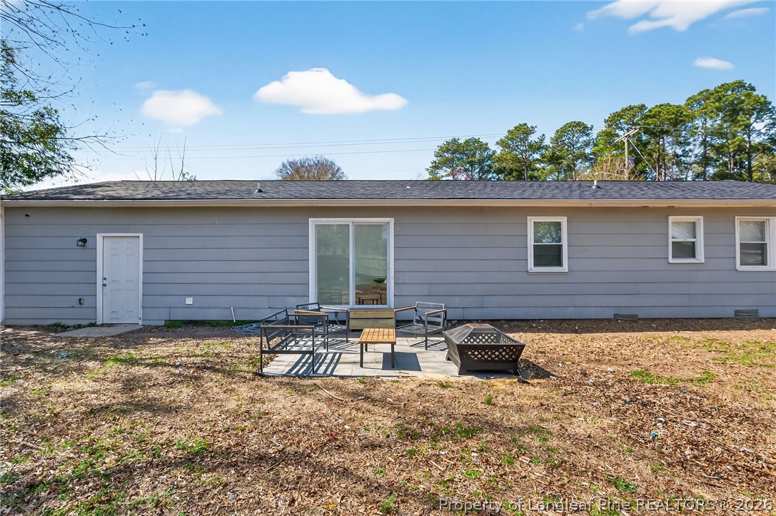 1083 Strickland Bridge Road Fayetteville, NC 28304 - Photo 21 of 25 a backyard of a house with table and chairs