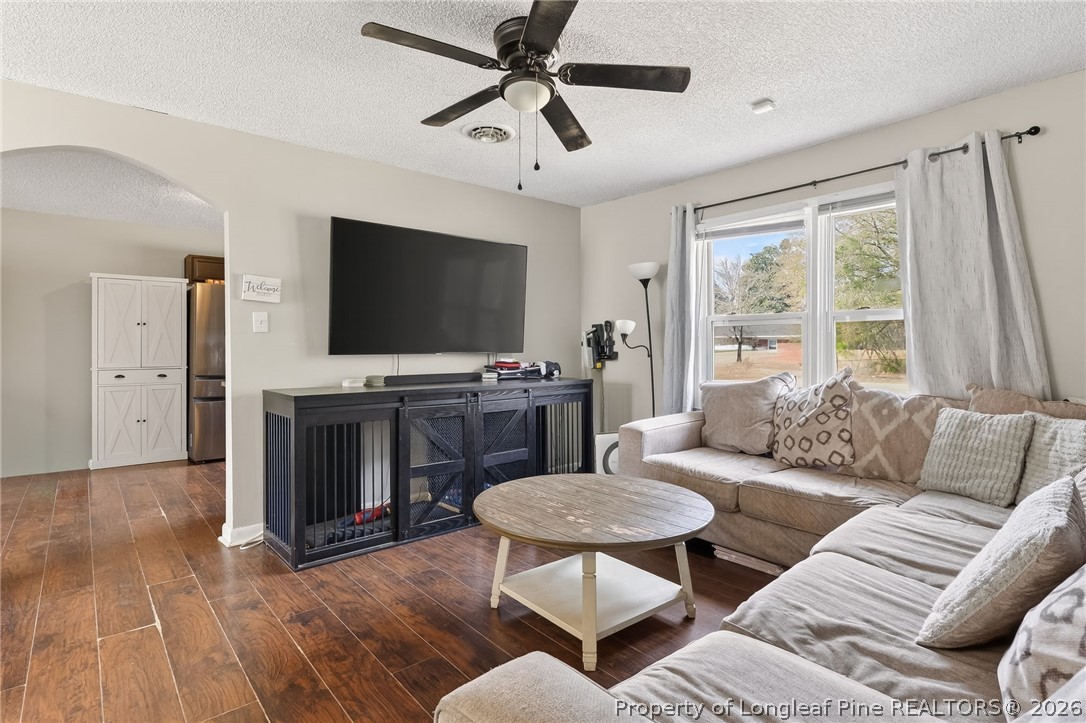 1083 Strickland Bridge Road Fayetteville, NC 28304 - Photo 4 of 25 a living room with furniture and a flat screen tv