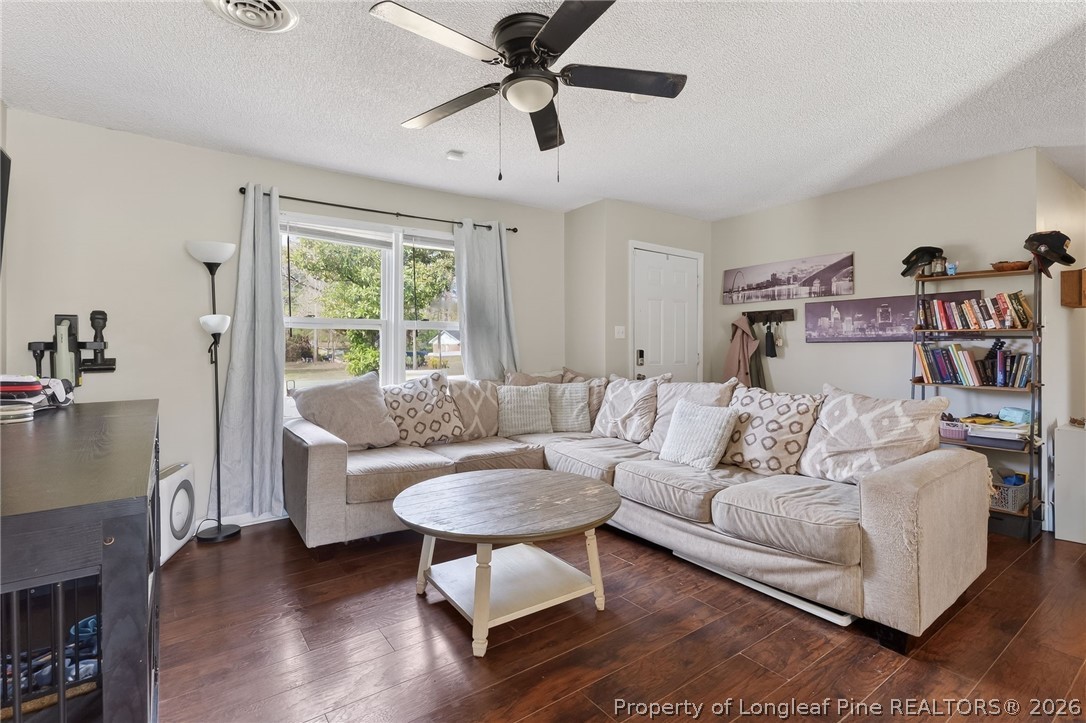 1083 Strickland Bridge Road Fayetteville, NC 28304 - Photo 5 of 25 a living room with furniture and a large window