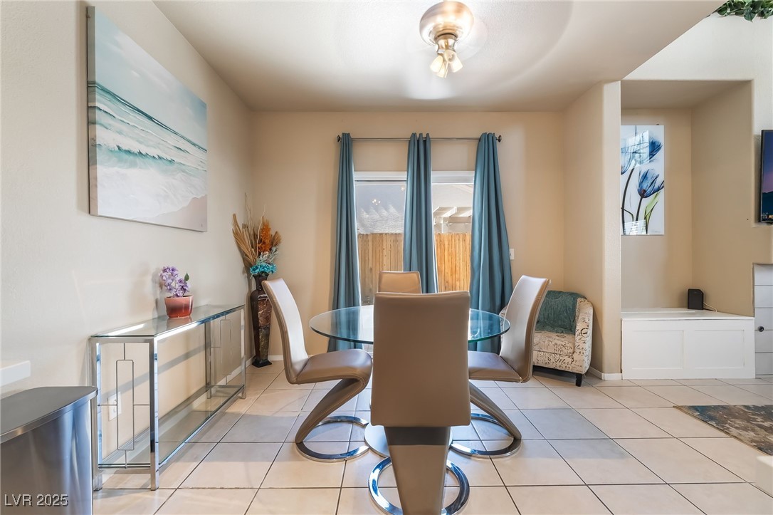 5322 Runningbrook Road Las Vegas, NV 89120 - Photo 8 of 25 Dining room featuring light tile patterned floors