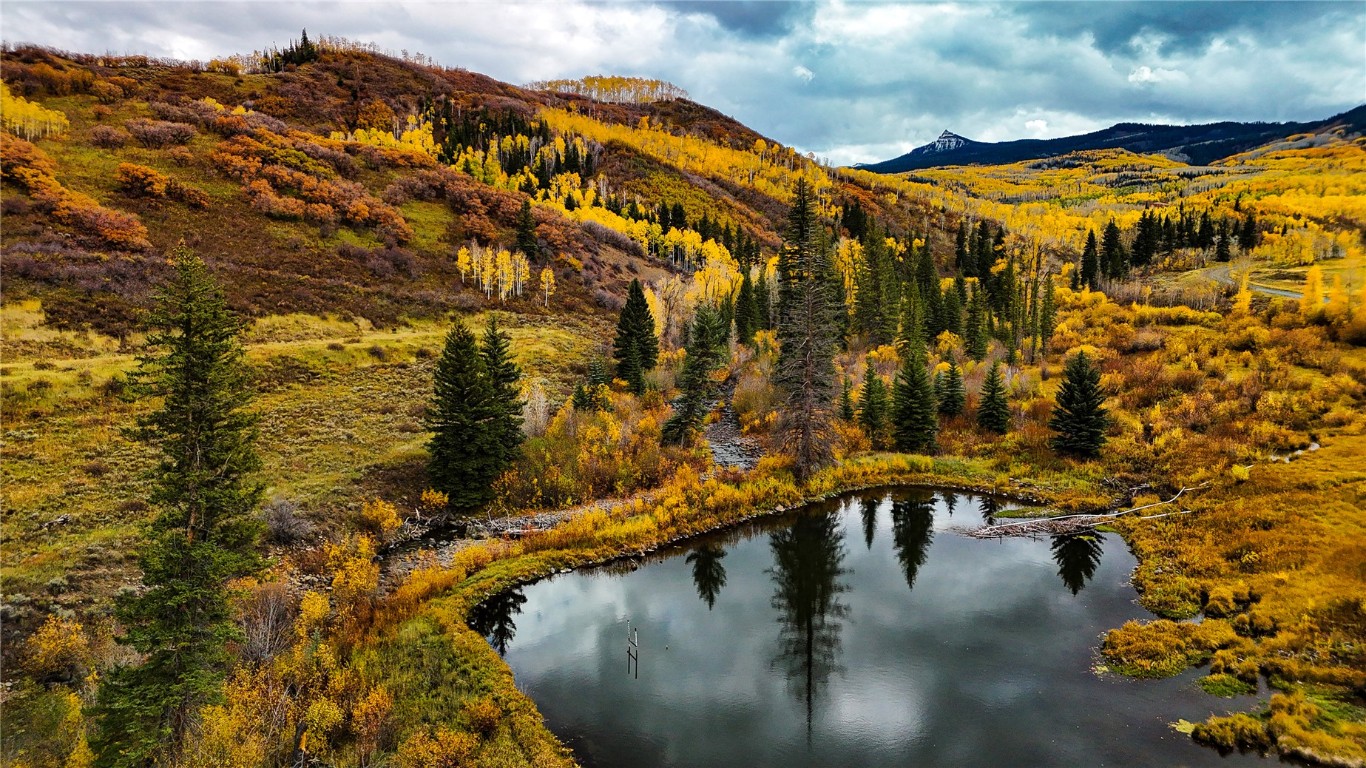 a view of swimming pool with outdoor seating