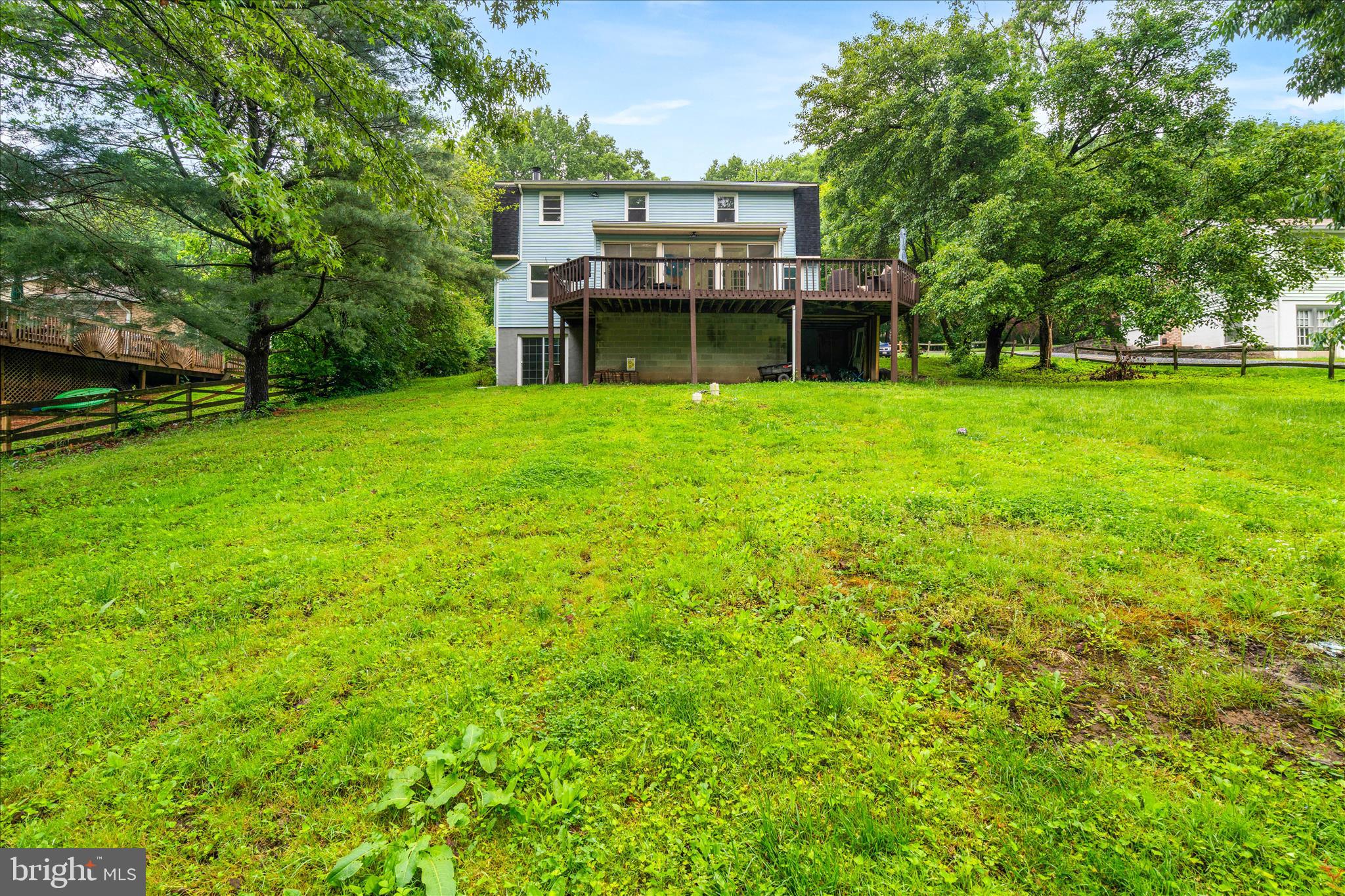 4217 Bill Moxley Road Mount Airy, MD 21771 - Photo 46 of 57 a view of a house with a big yard and large trees