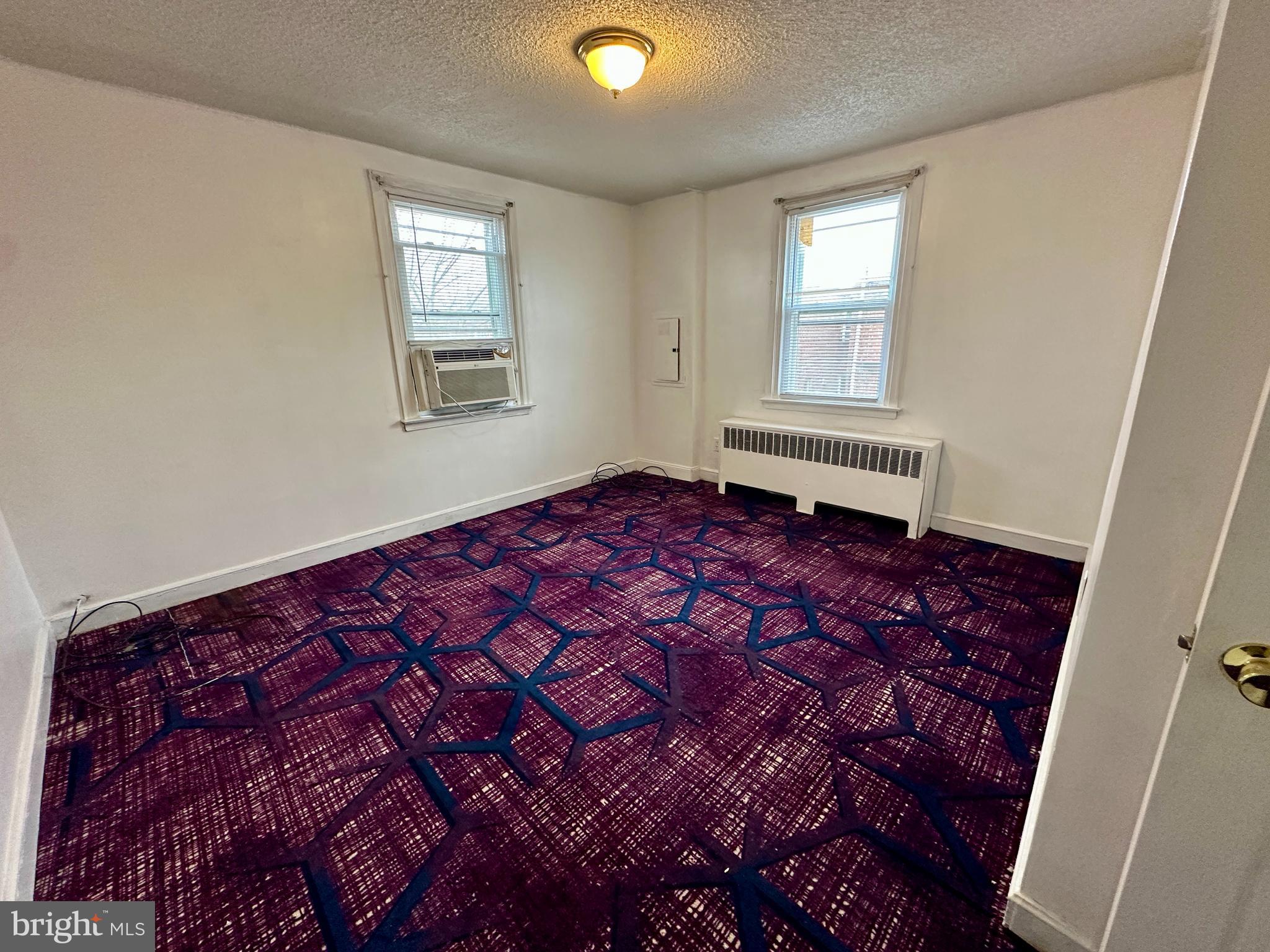 3236 Guilford Street, Unit 2 Philadelphia, PA 19136 - Photo 6 of 10 a bedroom with a bed and a window