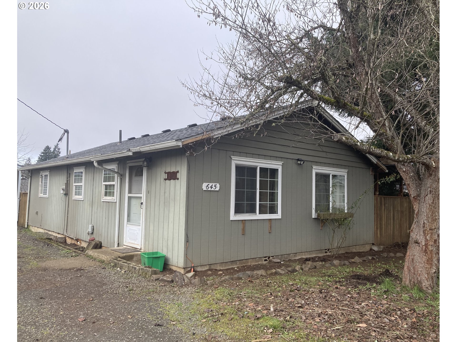 645 South 14th Street Cottage Grove, OR 97424 - Photo 1 of 15 a front view of a house with garden