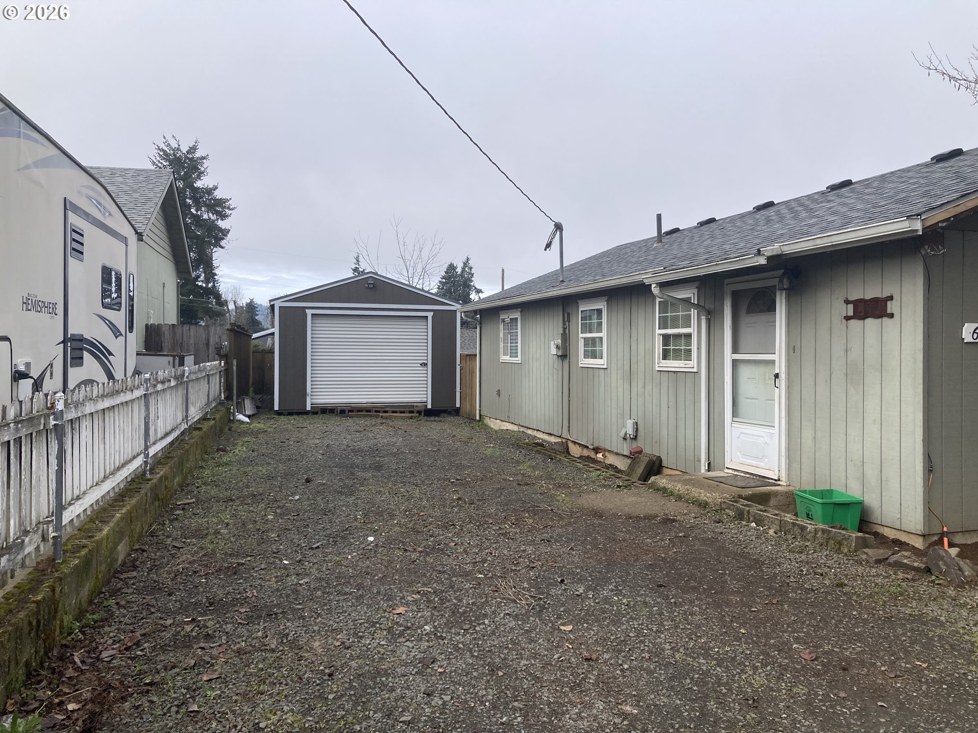 645 South 14th Street Cottage Grove, OR 97424 - Photo 5 of 15 a view of an house with backyard and garage