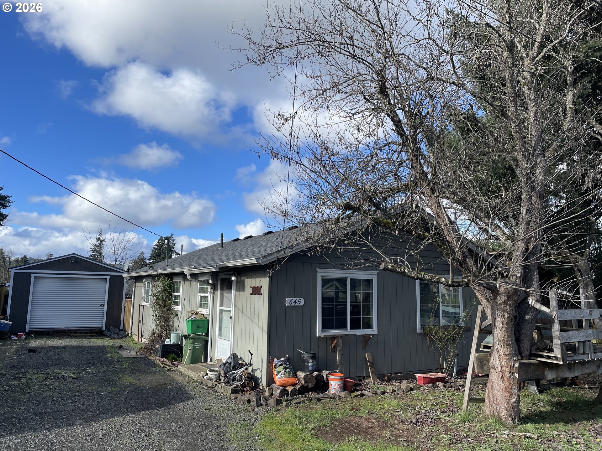 645 South 14th Street Cottage Grove, OR 97424 - Photo 9 of 15 a front view of a house with garden