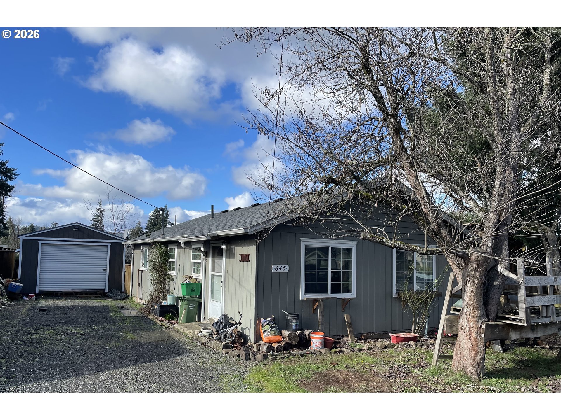645 South 14th Street Cottage Grove, OR 97424 - Photo 10 of 15 a front view of a house with garden