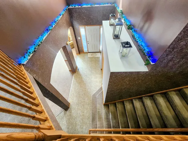 a view of a house with a yard and furniture