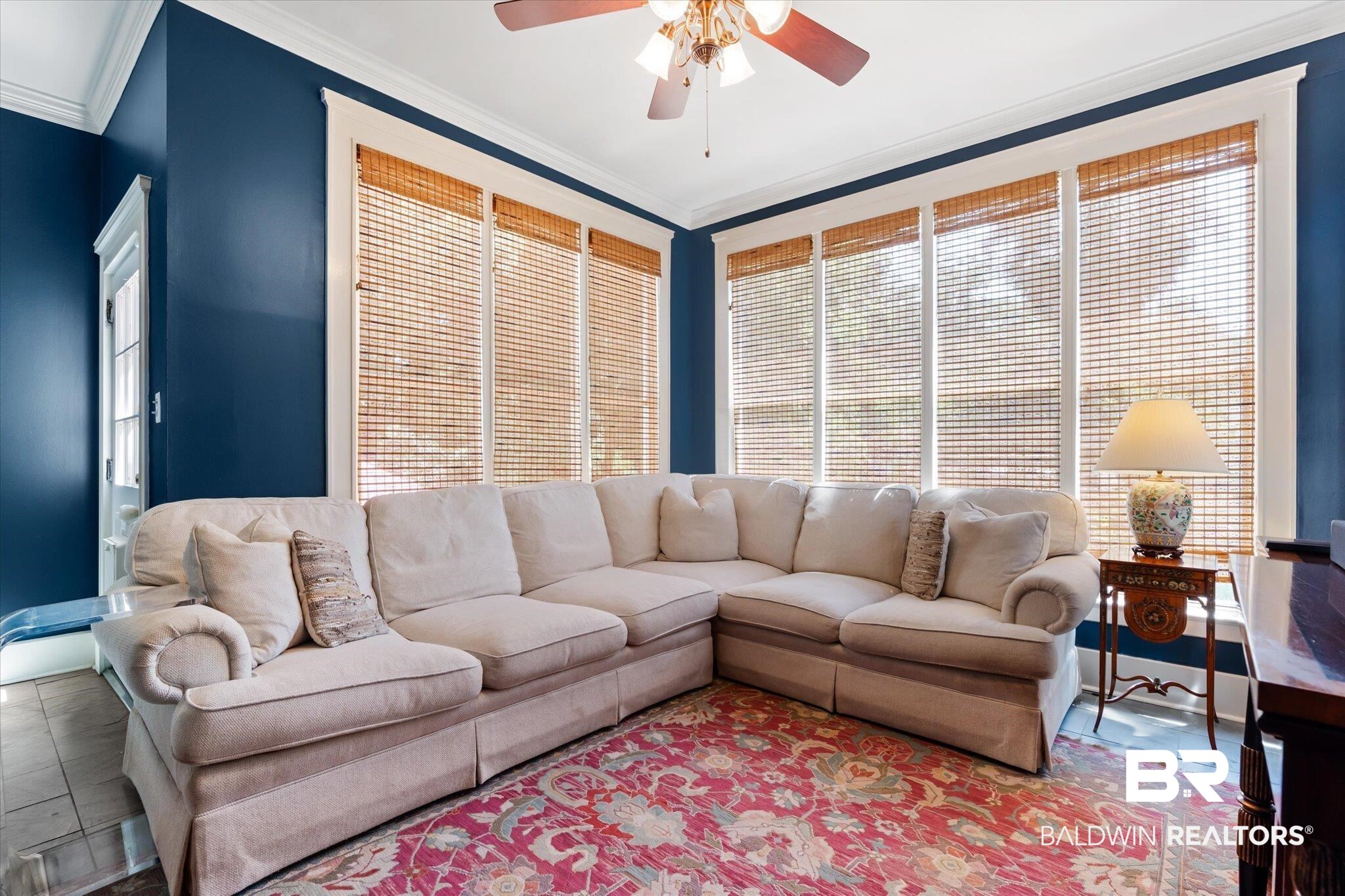 68 North Monterey Street Mobile, AL 36604 - Photo 10 of 30 Tiled living room featuring ceiling fan and crown molding
